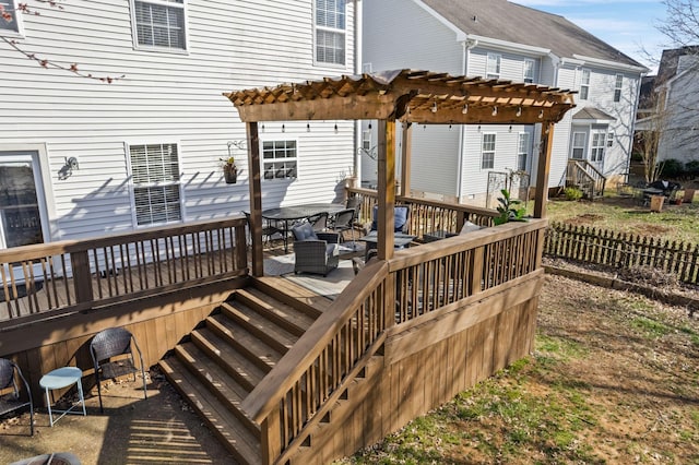 wooden terrace featuring a pergola and outdoor dining space