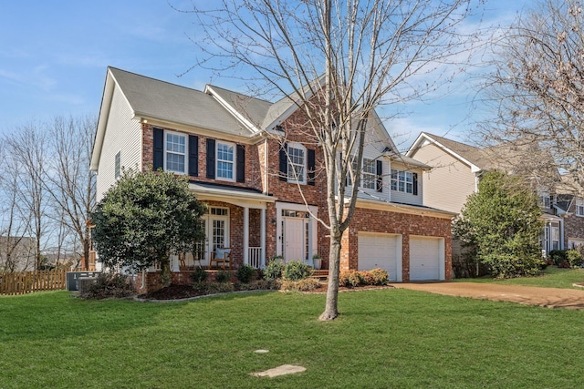 view of front of house featuring a front lawn, concrete driveway, brick siding, and an attached garage