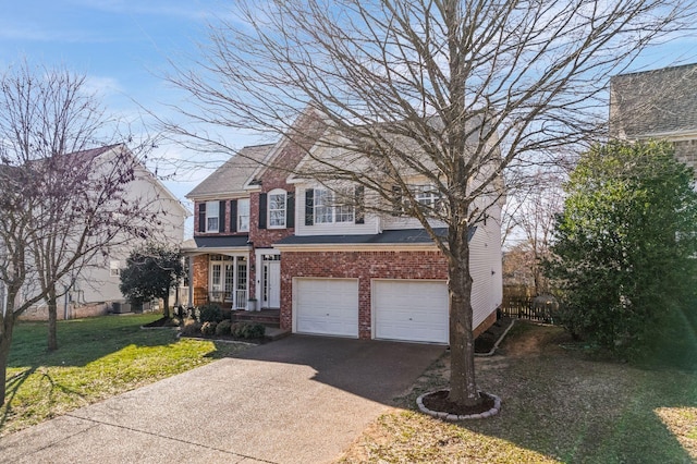 view of front of home with driveway, an attached garage, a front yard, and brick siding