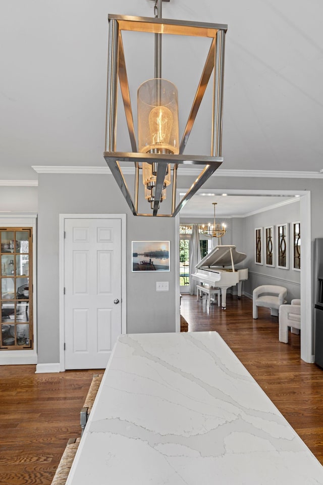 bedroom with a chandelier, dark wood finished floors, baseboards, and ornamental molding