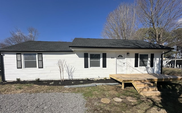 view of front of house featuring a shingled roof