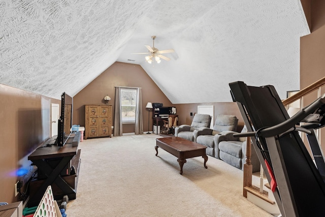 living area with lofted ceiling, carpet, a ceiling fan, and a textured ceiling