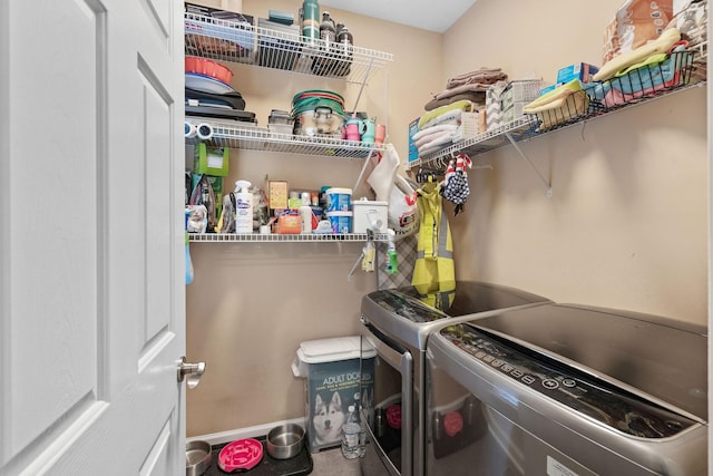 laundry area featuring laundry area and washer and clothes dryer