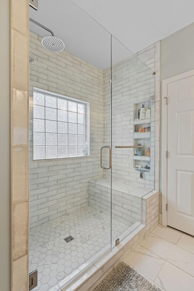 full bath featuring a shower stall