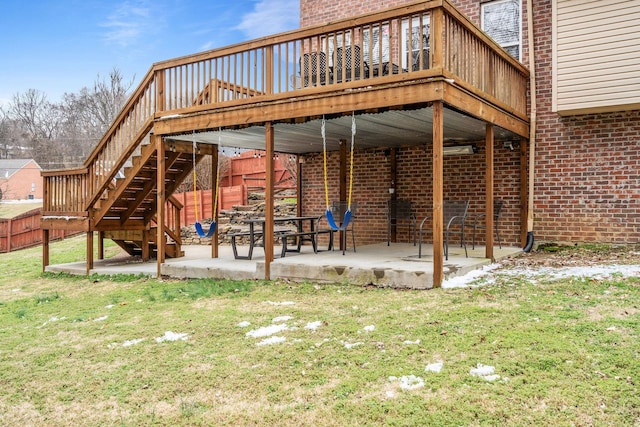 view of patio / terrace with a deck, stairway, and fence