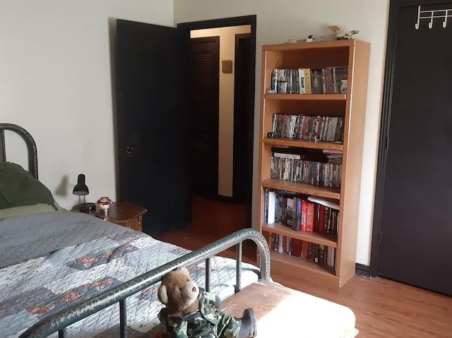bedroom with wood finished floors