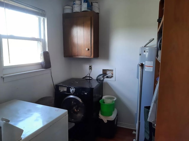 laundry area featuring cabinet space, washing machine and clothes dryer, and water heater