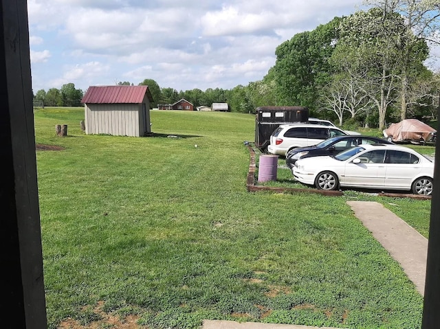 view of yard with a shed and an outdoor structure