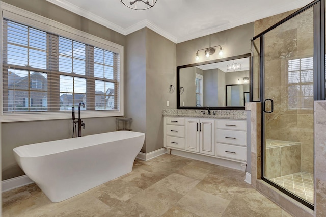 bathroom featuring a stall shower, baseboards, a soaking tub, crown molding, and vanity