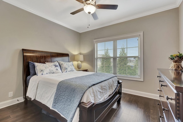 bedroom with crown molding, dark wood finished floors, a ceiling fan, and baseboards