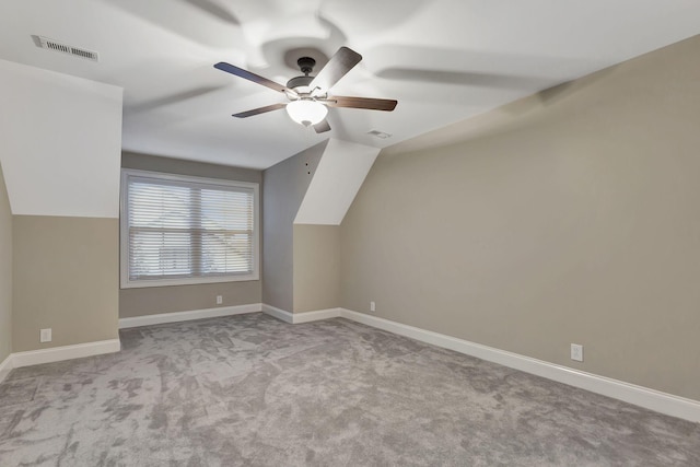 bonus room featuring vaulted ceiling, carpet, visible vents, and baseboards