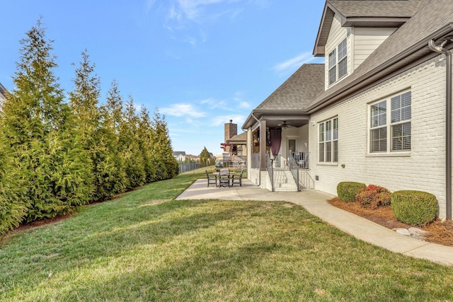 view of yard with a patio and fence