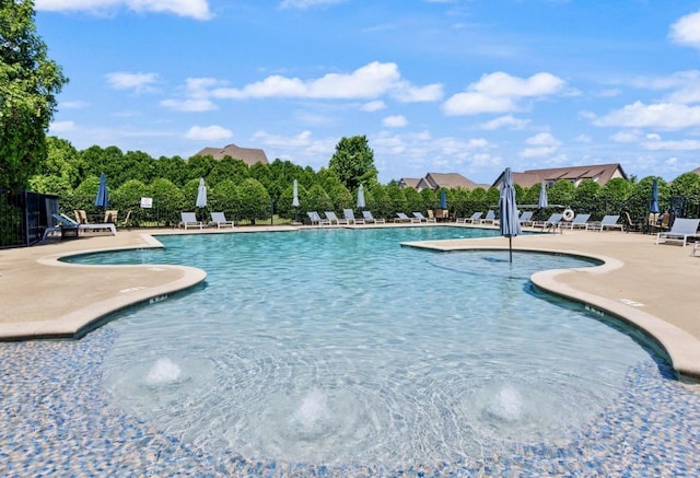 pool featuring a patio area and fence