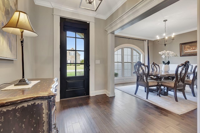 foyer entrance featuring a wealth of natural light, dark wood-style flooring, and crown molding