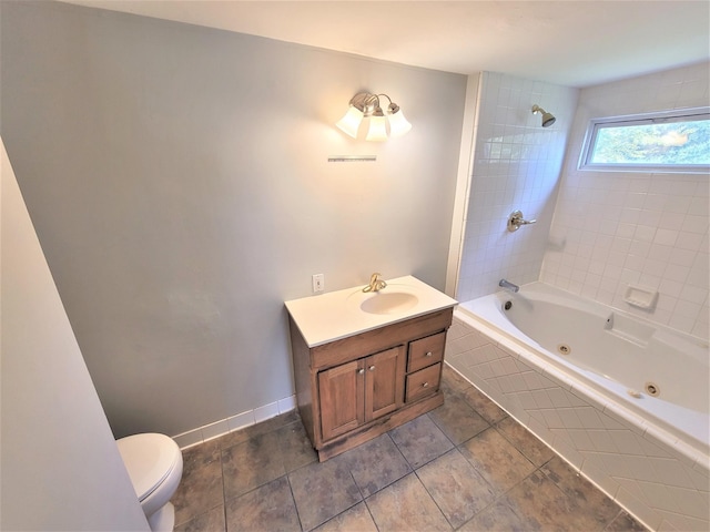 full bathroom with a combined bath / shower with jetted tub, vanity, toilet, and baseboards