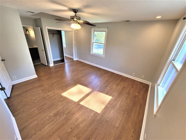 unfurnished bedroom featuring visible vents and baseboards