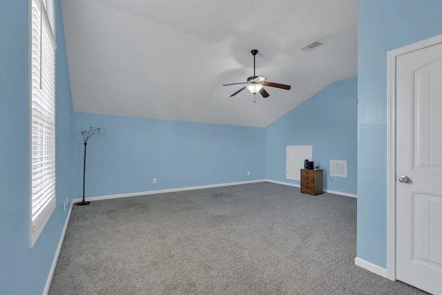 bonus room with lofted ceiling, baseboards, visible vents, and carpet flooring