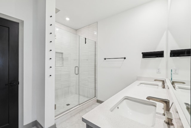 full bathroom featuring a stall shower, a sink, recessed lighting, and double vanity