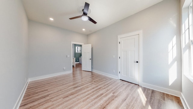 unfurnished bedroom with light wood finished floors, baseboards, a ceiling fan, and recessed lighting