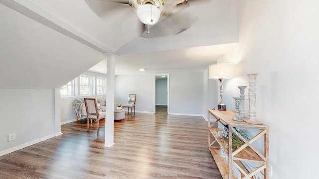 sitting room with lofted ceiling, ceiling fan, baseboards, and wood finished floors