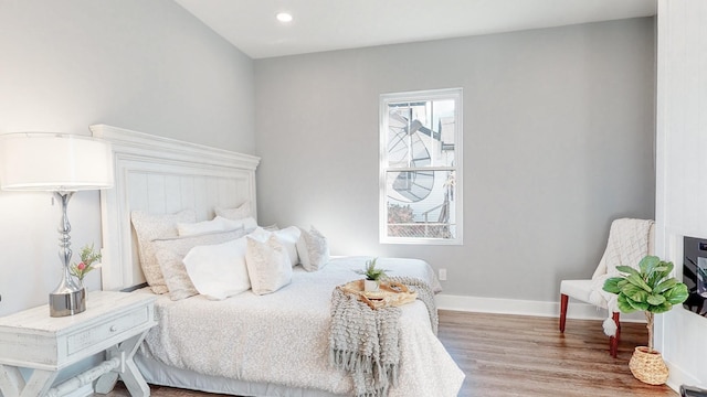 bedroom featuring recessed lighting, baseboards, and wood finished floors