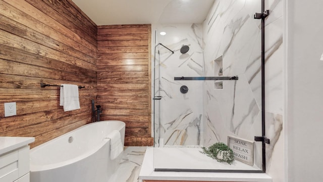 bathroom featuring a freestanding tub, wood walls, vanity, marble finish floor, and a marble finish shower