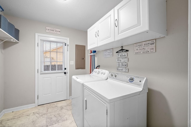 laundry room with baseboards, washer and dryer, marble finish floor, electric panel, and cabinet space