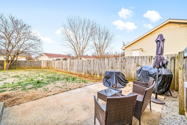 view of patio / terrace with area for grilling and a fenced backyard