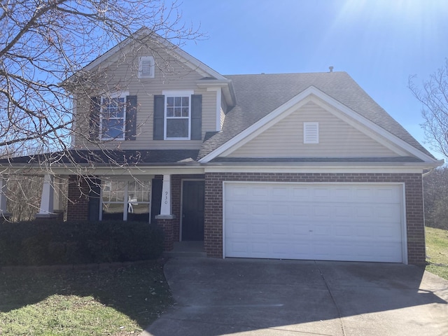 view of front of home featuring a garage, covered porch, brick siding, driveway, and roof with shingles