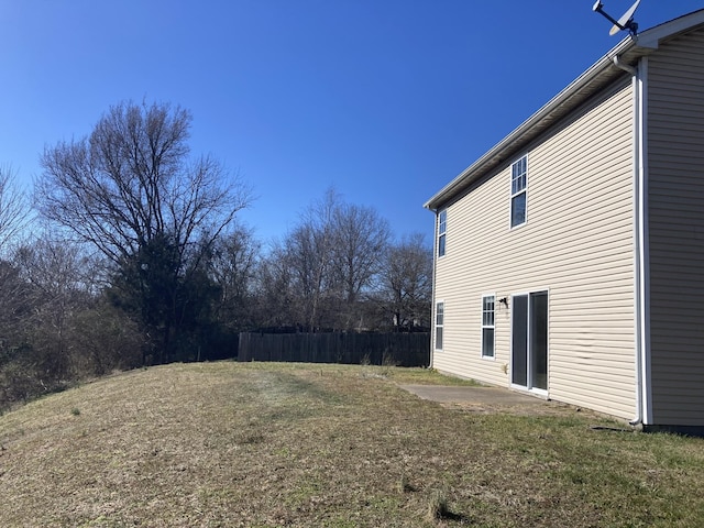 view of yard with fence and a patio