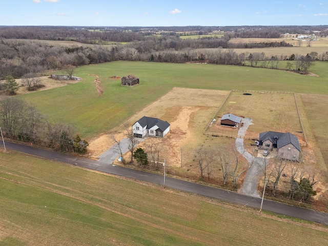 birds eye view of property with a rural view