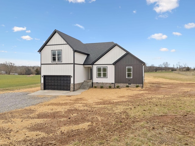 modern inspired farmhouse with a garage, concrete driveway, crawl space, and roof with shingles