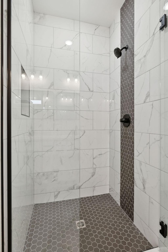 bathroom with a tile shower