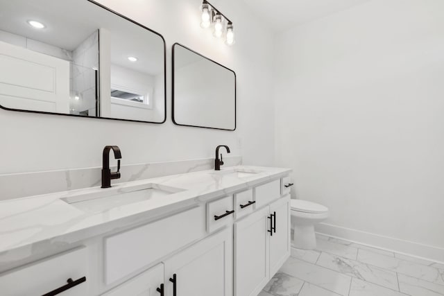 full bathroom featuring marble finish floor, a sink, baseboards, and toilet