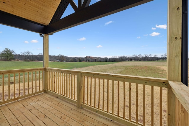 wooden deck with a rural view