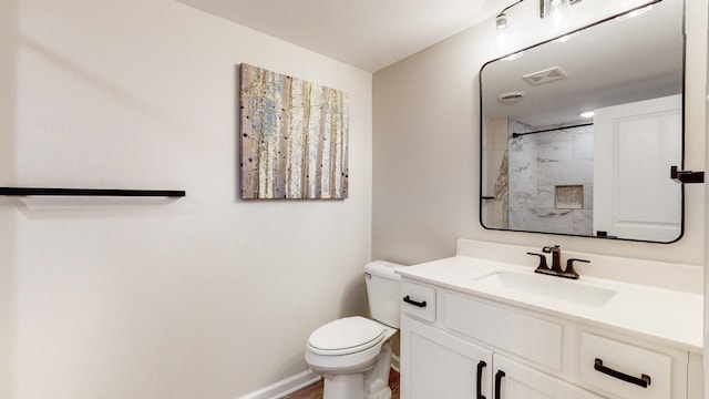 full bathroom featuring a shower, visible vents, toilet, vanity, and baseboards