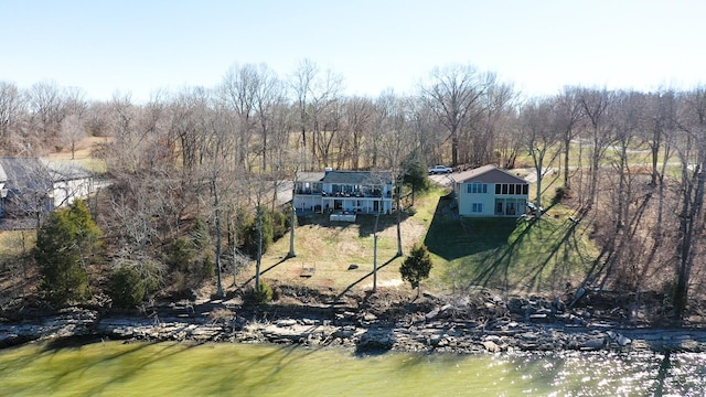 bird's eye view with a wooded view