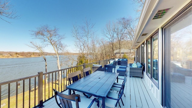 wooden deck featuring a water view, an outdoor living space, and outdoor dining space