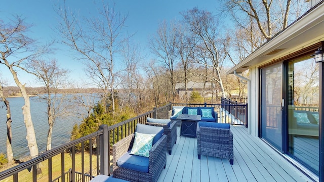 deck with a water view and an outdoor living space