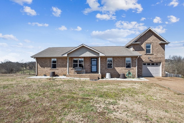 view of front of property featuring concrete driveway, an attached garage, brick siding, and a front lawn