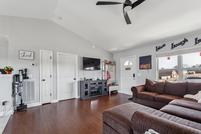 living area with visible vents, baseboards, ceiling fan, vaulted ceiling, and hardwood / wood-style floors