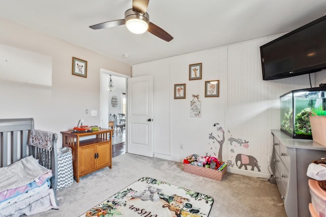 bedroom with light carpet and ceiling fan