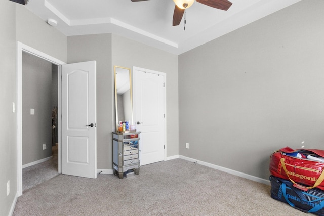 carpeted bedroom featuring a ceiling fan and baseboards