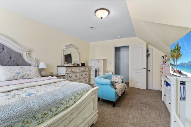 bedroom featuring vaulted ceiling, visible vents, and light carpet