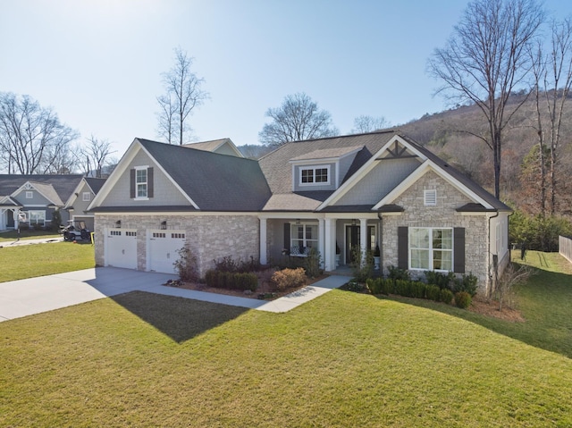 craftsman inspired home with stone siding, concrete driveway, and a front yard