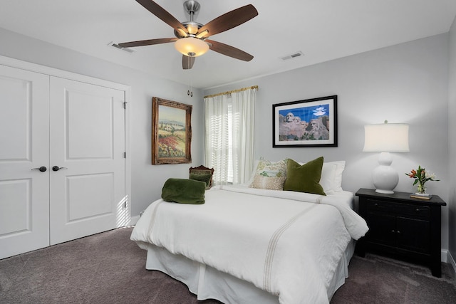 bedroom featuring carpet, visible vents, a ceiling fan, and a closet