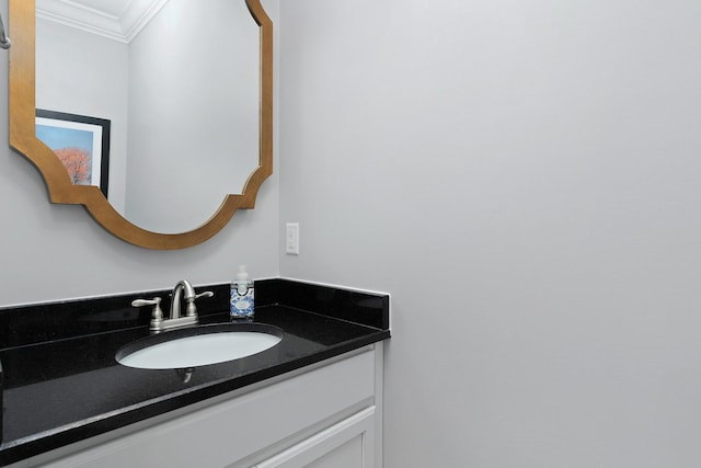 bathroom featuring ornamental molding and vanity