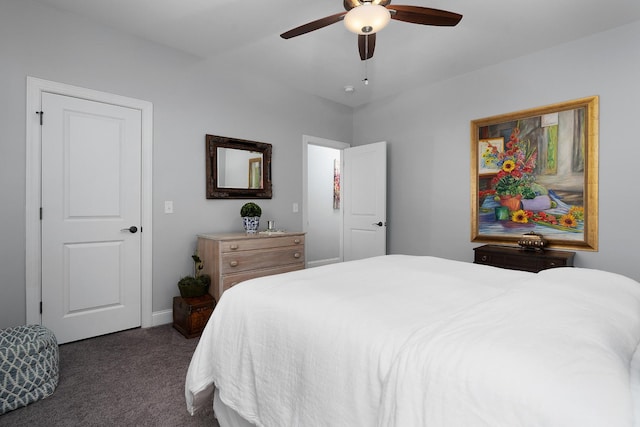 bedroom with ceiling fan and dark carpet