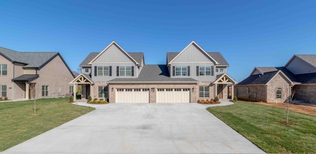 craftsman-style home featuring driveway, board and batten siding, and a front yard