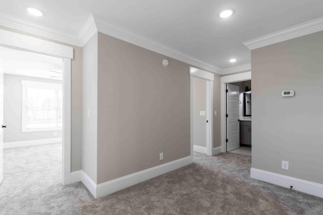 empty room featuring baseboards, ornamental molding, carpet flooring, and recessed lighting